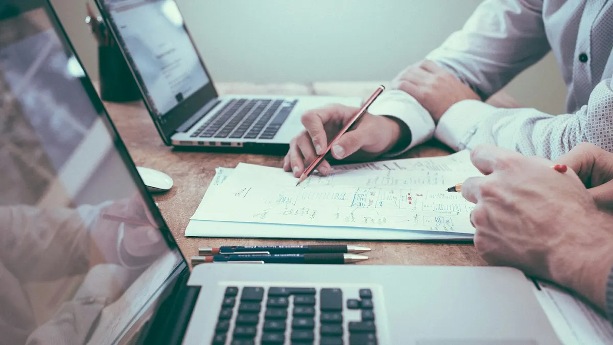 Colleagues planning document requirements at a desk