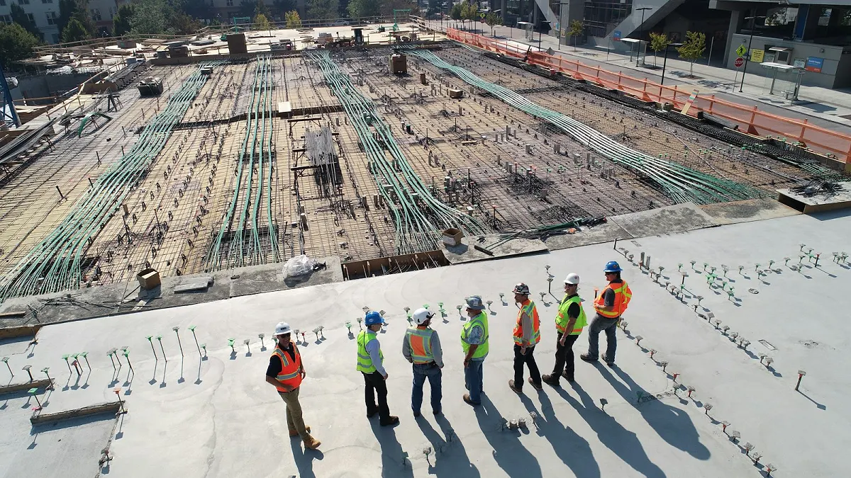 Construction workers reviewing a building site